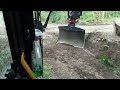 Clearing a ditch with a V bucket and Rototilt