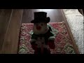 Dog reacts to funny snowman