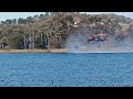 3 helicopters getting water for fires