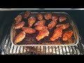 Frozen chicken wings on Pit Boss pellet grill w charcoal pellets!