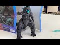 Godzilla coming out of his box