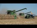 Two John Deere S780 Combines Harvesting Corn with John Deere Tractors