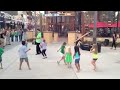 A bunch of kids dancing to street music at Downtown Disney