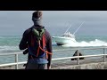 Boats leaving rough inlet