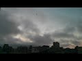 Clouds and copter roll in over Lafayette Park.