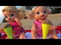 Milusik Lanusik and Dolls Play with colored Ice Cream Toys and cakes from sand on the Beach