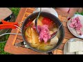 Girl camping alone despite heavy rain, enjoying beef hot pot, relaxing with the sound of rain