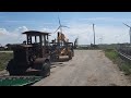 Unloading vintage Cat grader