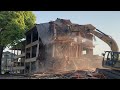 Caterpillar Excavator Demolishes 3-Story Apartment Building