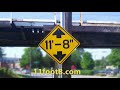 Speeding truck runs light and pops a wheelie at the 11foot8 bridge