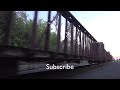 Brave Cat crossing the rail track with spare inches from the Locomotive