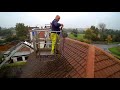 Roof cleaning using a pressure washer and a 16m tracked spider platform