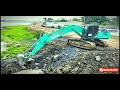 Bulldozer And Excavator Pushing Stone Into The Big Lake With Dump Truck 20 Tons