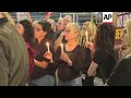 Sirens sound and relatives of hostages light candles in Tel Aviv as Israel marks Memorial Day