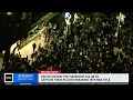 Celtics fans climb parking garage sign by TD Garden after win