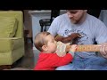 Chicken Noodle Baby playing guitar