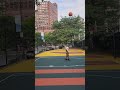 grandson playing ball in Lower Manhattan