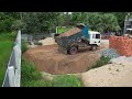 Preparing clearing out grass in water by Bulldozer D20 Push soil drop down