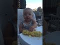 Baby eats corn like a savage!