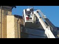 Gutter cleaning using a tracked access spider platform