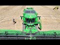 Wheat harvest 2024 new combine harvester John Deere S7 900 crawler & Grain farming on the Baltic Sea