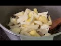 Life and everyday affairs in a high-mountain village in early spring. Potatoes with meat on wood