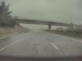 Tesla AP 2020.32.1 at 100 km/h on a motorway in rain