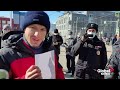 Russian police arrest man holding up blank sheet of paper