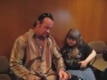 The Undertaker from the WWE breaks character and greets a young fan.