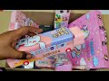 Box full of pink stationery - doraemon sharpner, password lock pencil box, projector watch, eraser