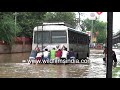 Delhi's Vasant Vihar goes under after heavy rains: Poor hapless passengers push their own bus!