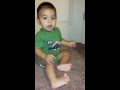 Baby plays with door stop