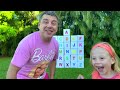 Nastya and dad open boxes with surprises to learn the alphabet.