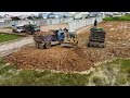 Wonderful By Komatsu D20p Dozer Push the soil into the water With Dump trucks Land transport