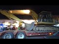 Not easy to load an excavator on a truck