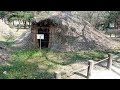 Up to Prehistoric Straw Thatched Hut Site with Escalator