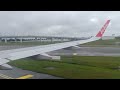 AirAsia Airbus A320-216(WL) smooth landing at KUL during cloudy day.