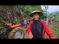 Tractors carrying timber during the rainy season must be pulled up by another vehicle