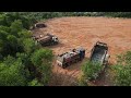 The Best Big Project Equipment Bulldozer Pushing Big Rock Stone and Clear Forestry with Dump Truck