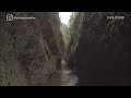 People hike through a freezing river to get to this waterfall in Oregon