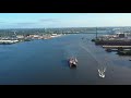 Aerial Drone Flight on Delaware River Towards Walt Whitman Bridge Philadelphia from Camden NJ.