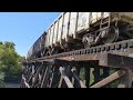 Train going over a wooden trestle bridge along the Brushy Creek Trail