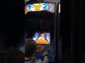 My son playing a Space Ace Arcade Machine