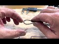 How to thread a tail belt through a boom easily