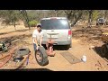 Replacing the tire on my dump trailer using the manual tire changer.