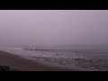 Golden Gate Bridge in heavy fog with waves and foghorns