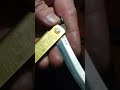 Peening a rivet through the pivot of a Higonokami knife.