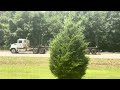 Western Star 4700SF day cab hauling an empty log trailer