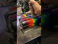 Rolling out 6 colors of ink with a large brayer for letterpress printing.