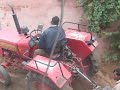Tractor moving dirt in India